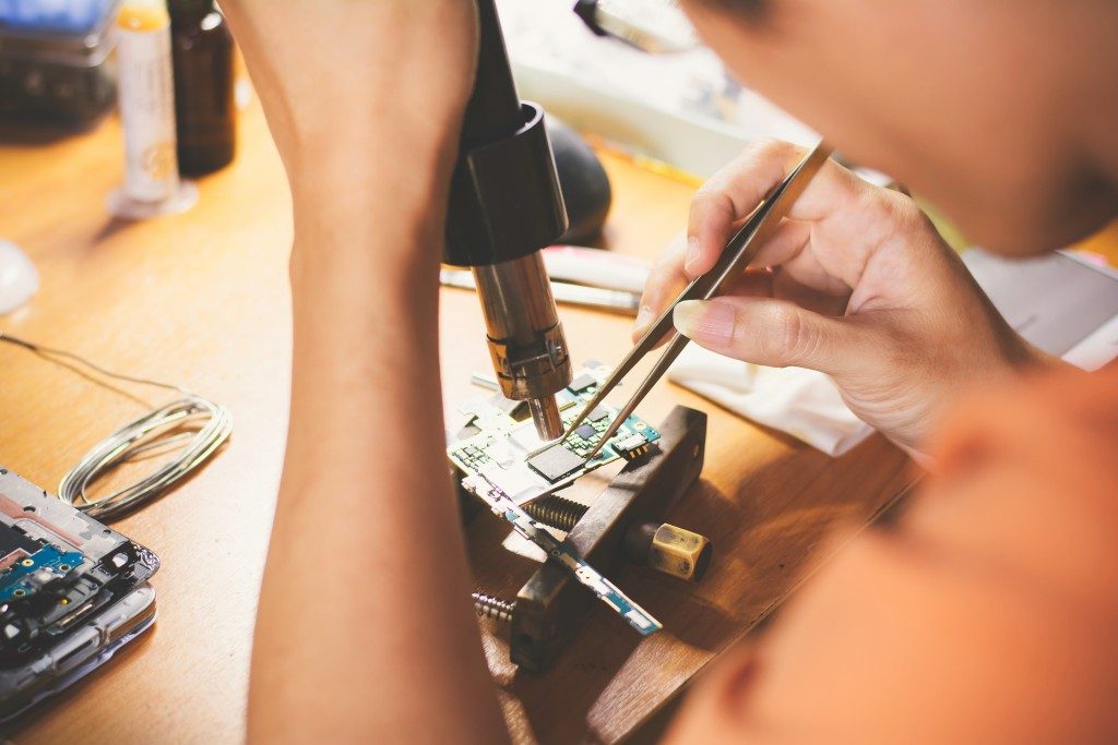 man repairing phone