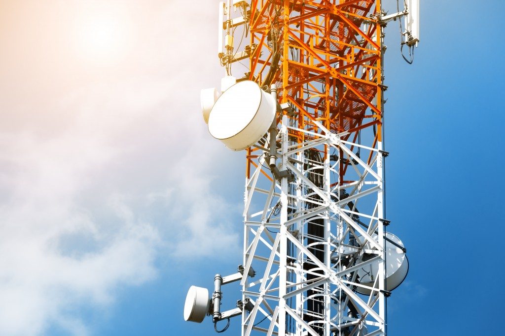 Telecommunication tower with antennas with blue sky