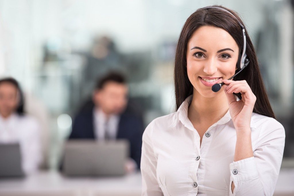 smiling female customer support phone operator