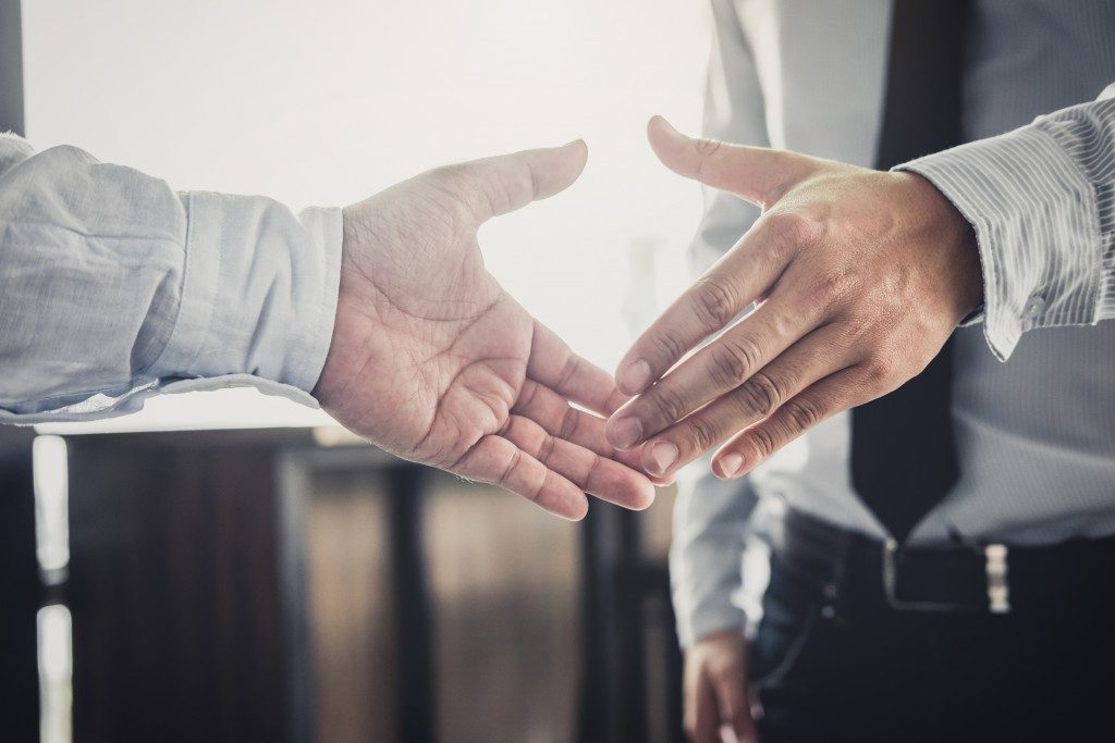 handshake between two employees