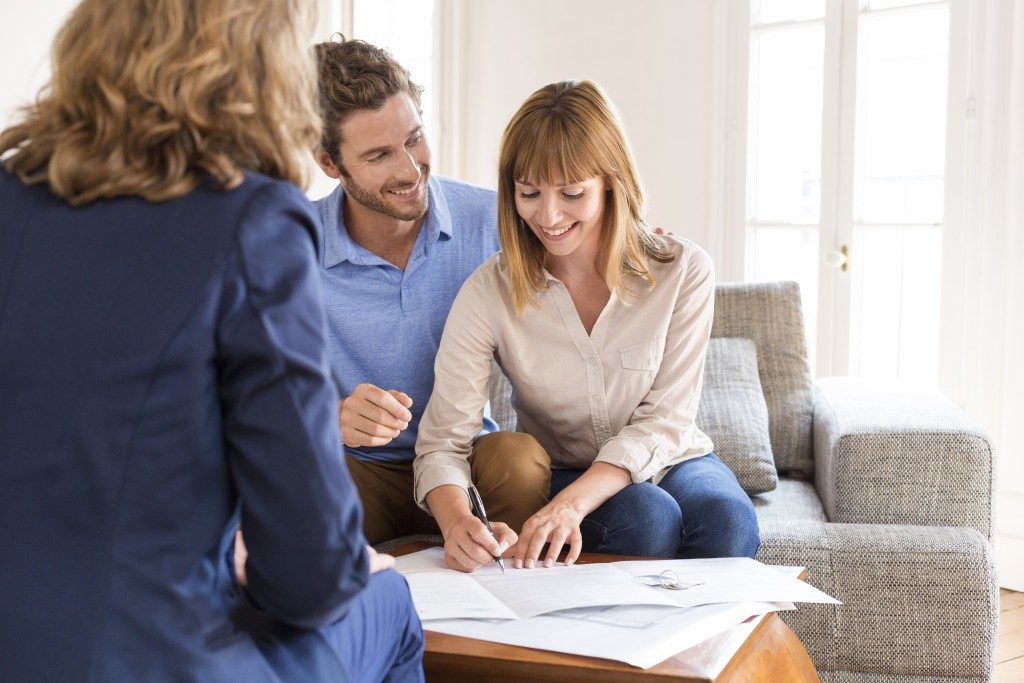 Couple with a real estate agent