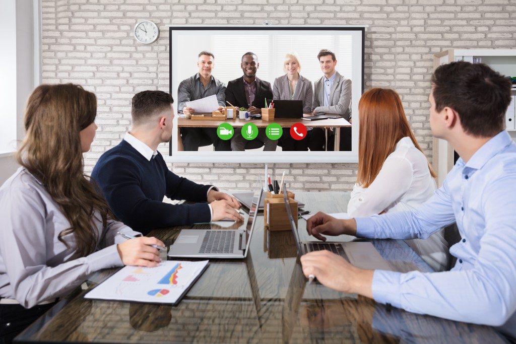 people at a video conference meeting