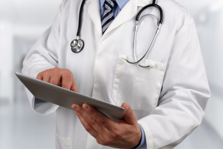 Doctor looking at data