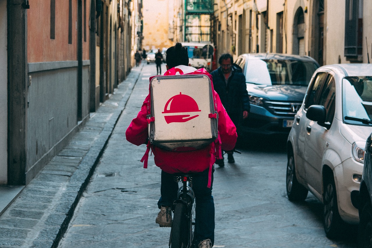 man delivering food on a bike