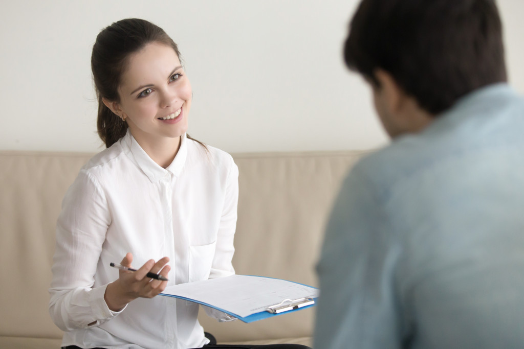 employee talking to a prospective client
