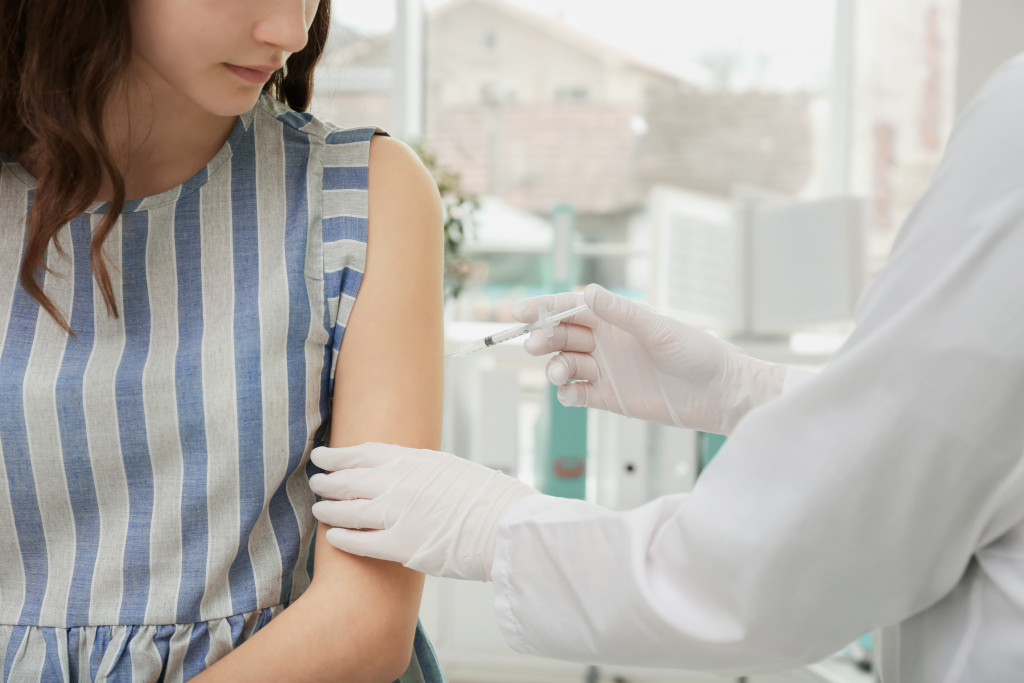 employee being vaccinated in a medical facility