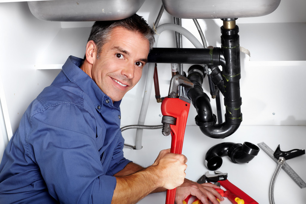 man holding a wrench