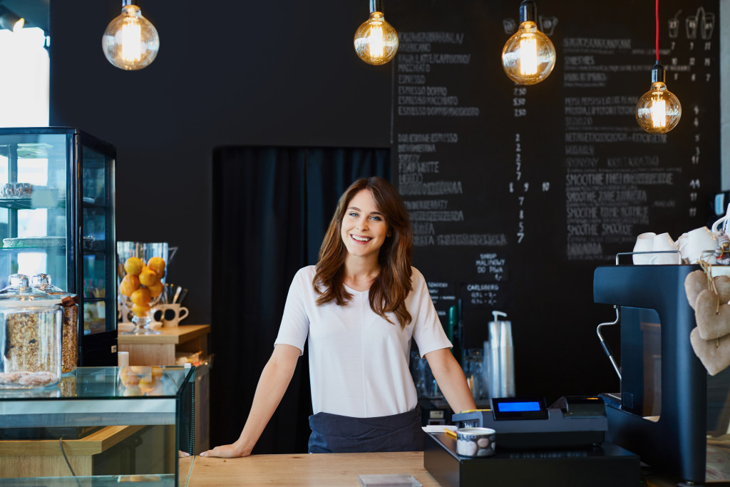 business owner standing at the cash register