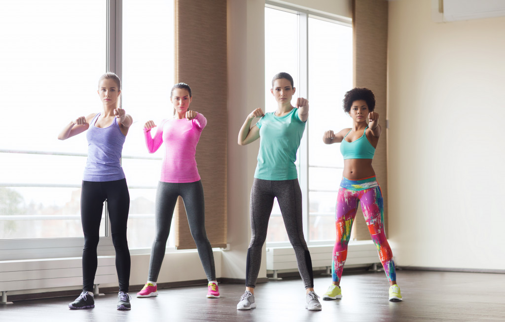 Female employees in office doing some workout to stay fit 