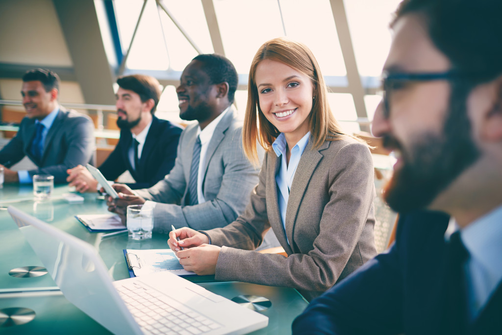 Engaged employees sitting around a conference table