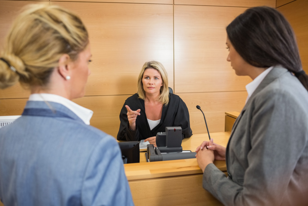 Female lawyer talking to a judge in court