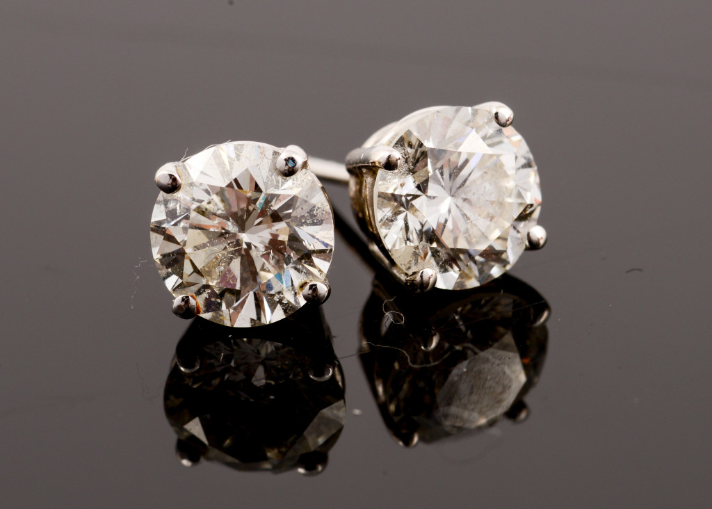 a pair of diamond stud earrings