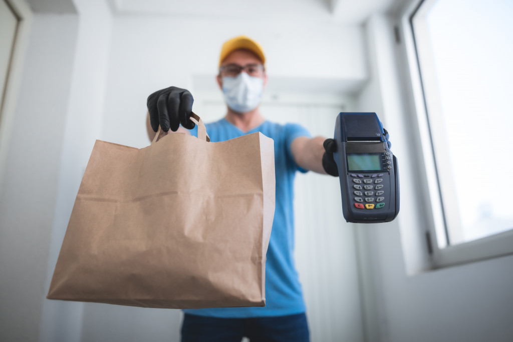 A man delivering contactless