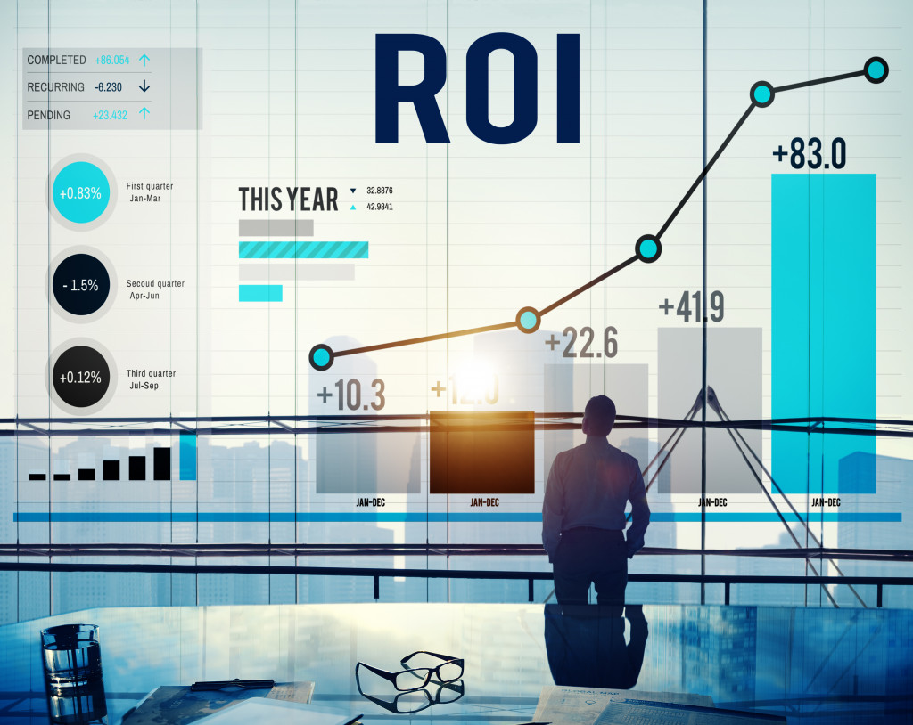 A businessman looking at an ROI chart