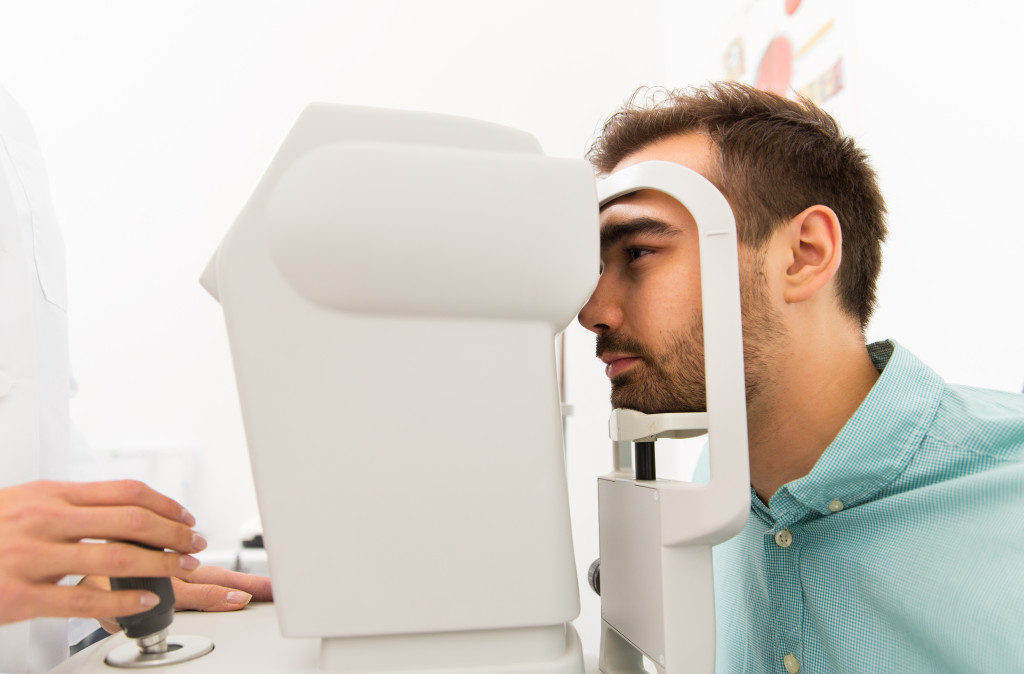 Man having his eyes checked by an optometrist
