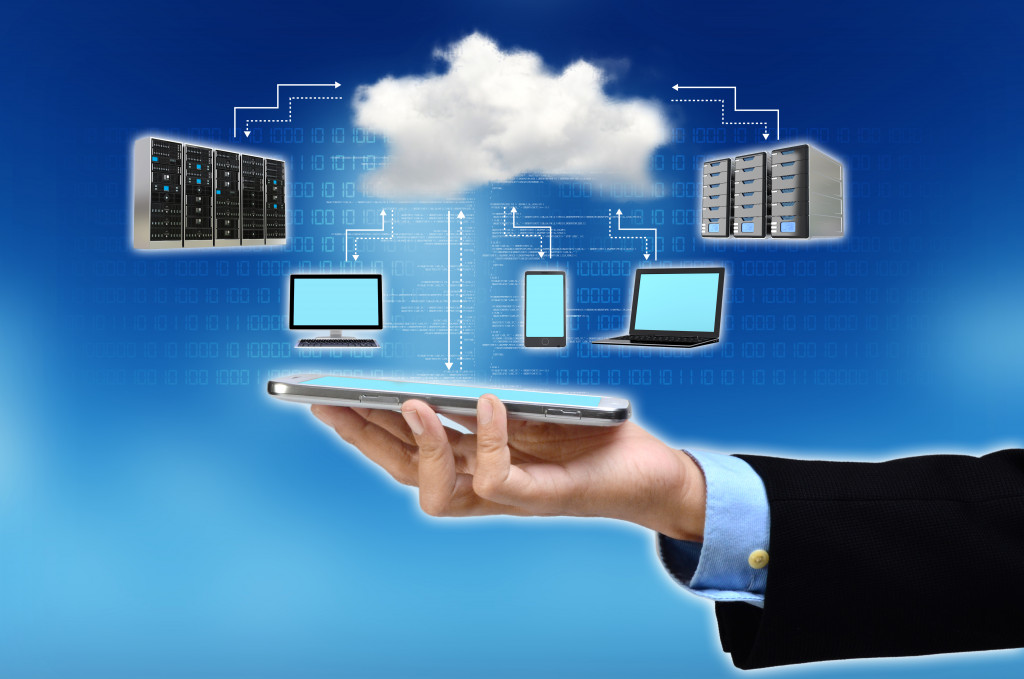 businessman holding concept of cloud tech as database