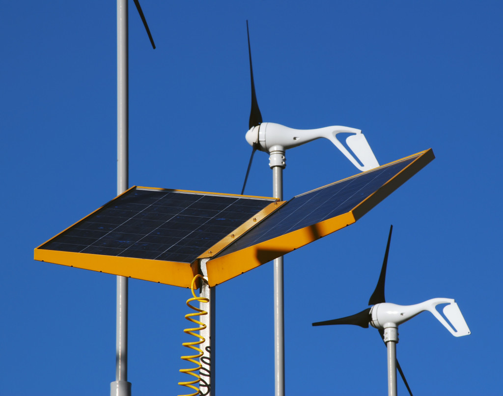 a solar panel and a windmill outdoors