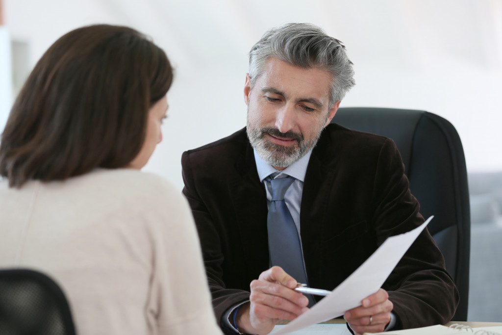 A businessman asking questions to a client