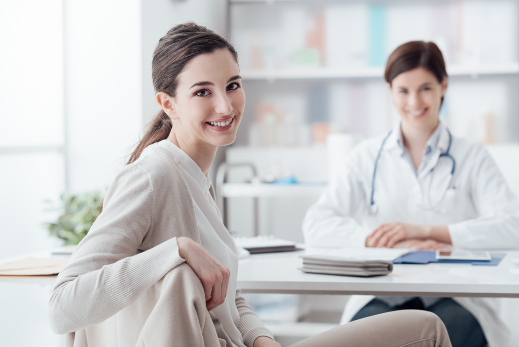 a woman having a check up with a doctor