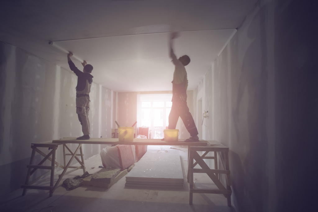 two contractor workers working in renovating the interiors of a home