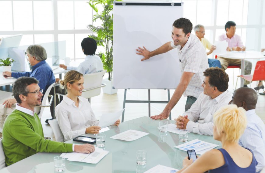 Employees of a startup company discuss plans for the business.