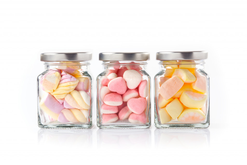 Three kinds of candies in different cannisters
