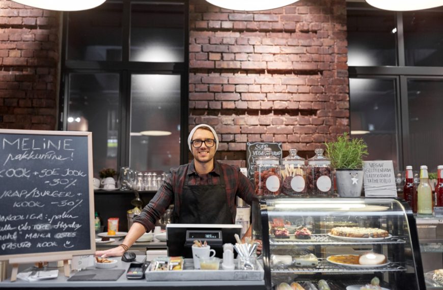 male coffee shop owner in the counter