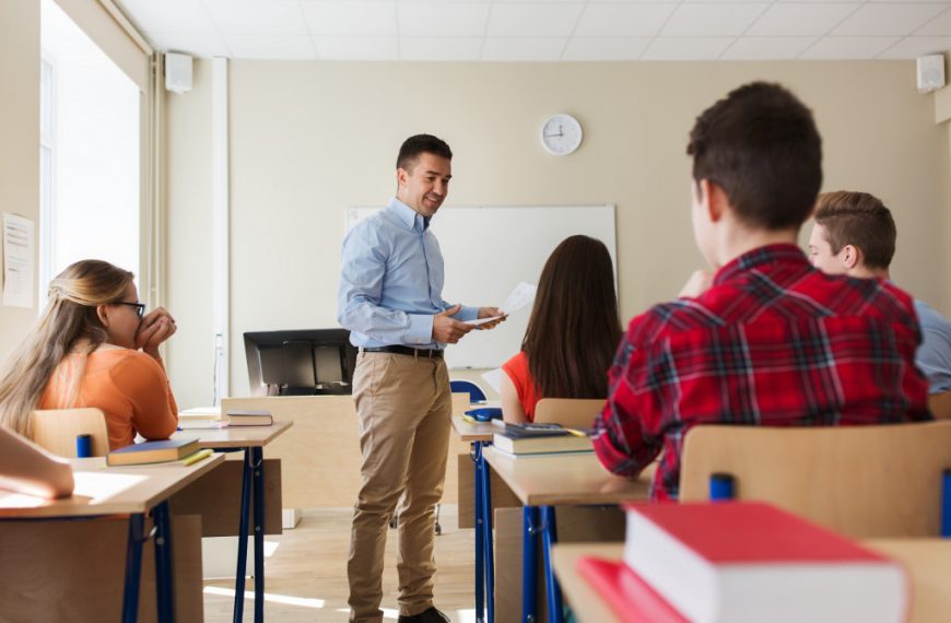 class of students listening to a teacher