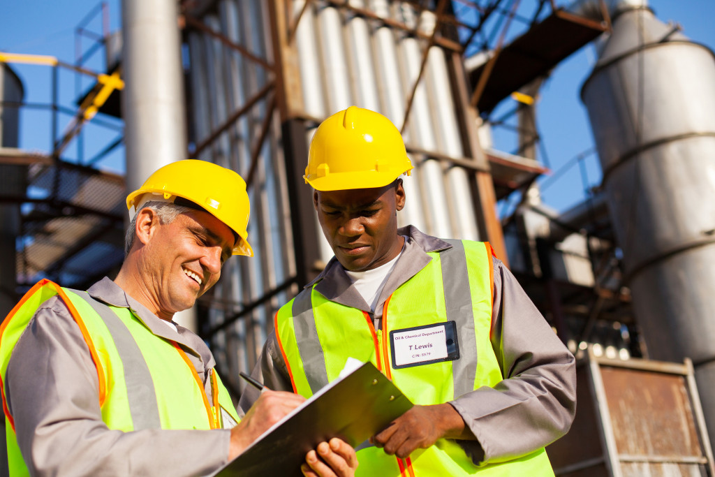 Two workers inspecting facilities