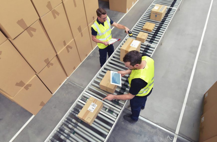 Warehouse workers using automation