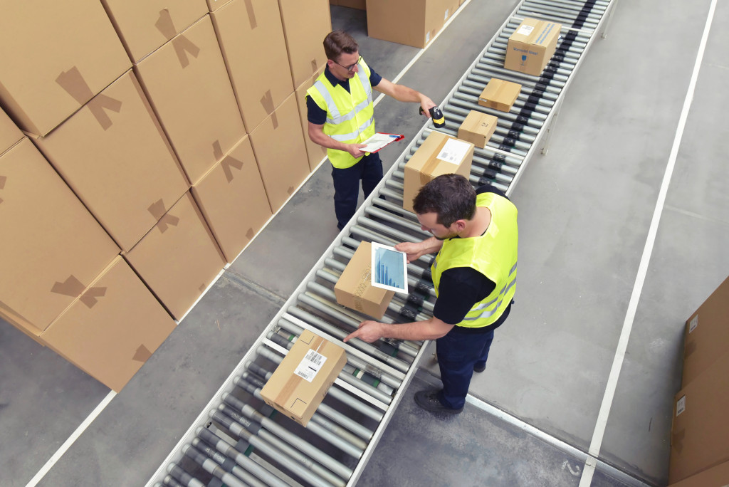 Warehouse workers using automation