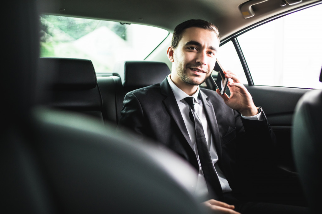 passenger in uber in business attire